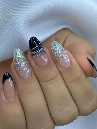 unha redonda preta com glitter